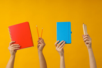 Office stationery in the hands of women.