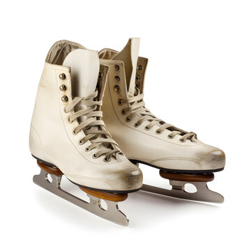 Old white ice skating shoes and blades isolated on white background - stock image. Vintage ice skates.