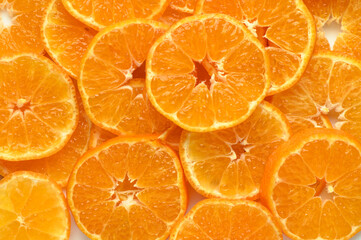 juicy and appetizing tangerines cut into circles as a food background 4