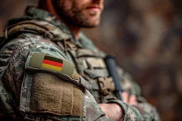 Fotobehang Unrecognisable man soldier of german army in uniform with german flag patch on shoulders. © AB-lifepct