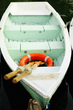 Green row boats with row at a lake