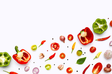 Various fresh vegetables and herbs on white background.