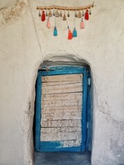 Old wooden door and colored cotton hangers