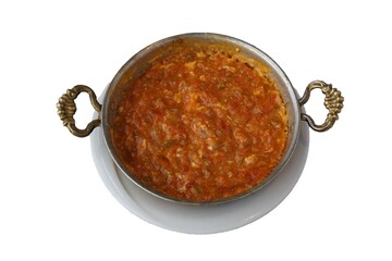 Turkish breakfast dish Menemen, eggs, tomatoes and peppers in a pan. isolated white background