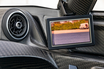 Modrn car LCD display functioning as a rear-view camera