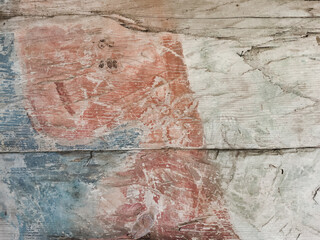 wooden wall with weathered paint close up