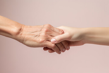 Intergenerational Support - Elderly Hand Holding Young Hand