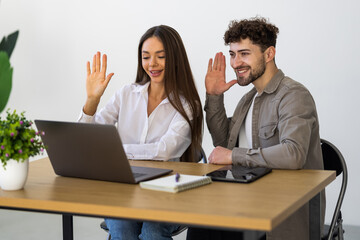 Fototapeta premium Young business couple have video call in office