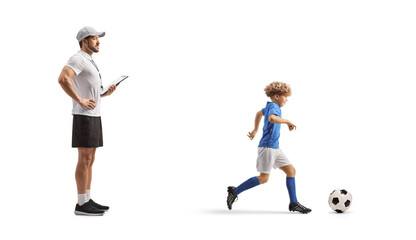 Coach watching a boy at football training