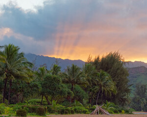 View from the Waioli Beach Park at amazing sunrise over trees and Hanalei mountains, Hanalei Bay, Island of Kauai, Hawaii
