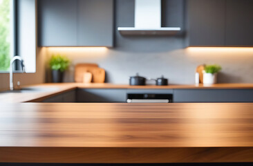 Front view of elegant interior with grey drawers kitchen cabinet. Empty wooden countertop and blur modern kitchen interior background in clean and bright, Banner, Ready for product montage