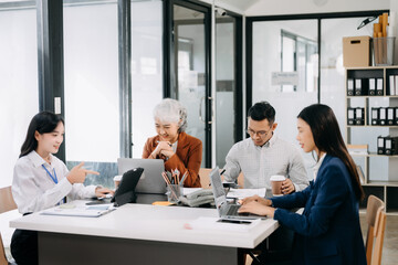  Young business creative team are brainstorming planning discussing while sitting in creative business discussing work in the modern office