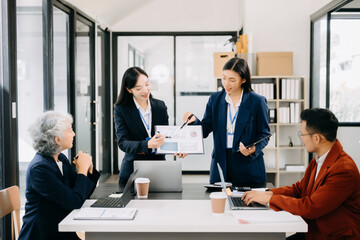 Business team discuss at meeting room. working together with laptop ,tablet and smart phone on desk Financial accountant , planner , meeting , introduction concept.