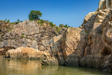 Fototapeta na wymiar Jabalpur, Madhya Pradesh/India : October 24, 2018 – Dhuandhar waterfall in Narmada river at Bhedaghat, Jabalpur.