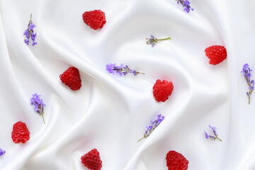 Scattered raspberries with lavender