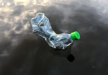 Marine plastic pollution from human activities at coastlines. Plastic waste in lake. Microplastics in groundwater. Ocean pollution and marine debris. Litter such as plastic from food in water of river