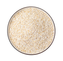 Raw barley groats in bowl isolated on white, top view