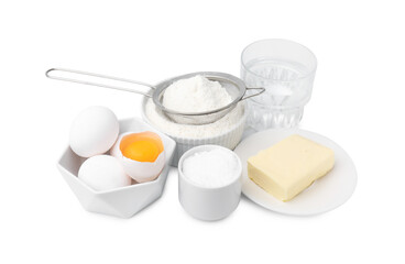 Eggs, butter, flour, salt and water isolated on white. Ingredients for puff pastry dough