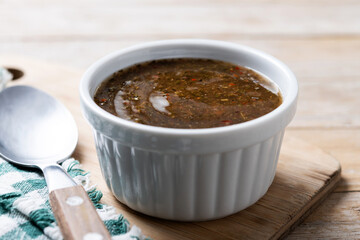 Green Chimichurri Sauce on wooden table