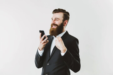portrait of happy young man wearing back shirt with beard talking on phone on isolated white background