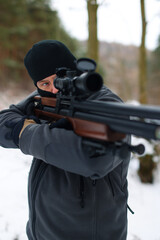  A shooting instructor shooting instructor aims at an optical sight