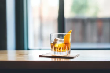 Crédence de cuisine en verre imprimé Manhattan manhattan cocktail with ice cubes and an orange twist
