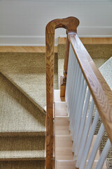 Elegant Wooden Staircase with Carpet Runner in Modern Home