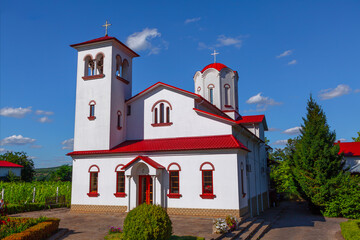 Church with garden in the village. Rustic place of worship 