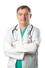 Portrait of a mature male Caucasian doctor. He is wearing a green Scrubs and a white lab coat with a stethoscope around his neck.