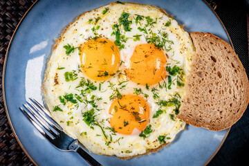 Fried eggs with a slice of bread
