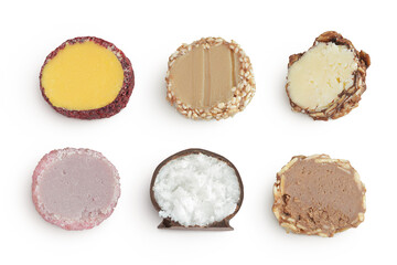 A variety of different truffles Isolated on a white background. Top view. Flat lay