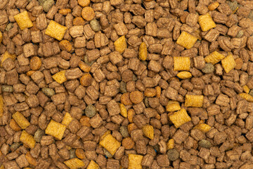 Dry food for puppies close-up. Complete diet for dogs during their first year of life