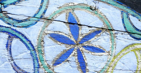 painted geometric shapes on an old wooden background
