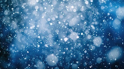 Falling snowflakes on night sky white background. Bokeh with white snow and snowflakes on a blue background