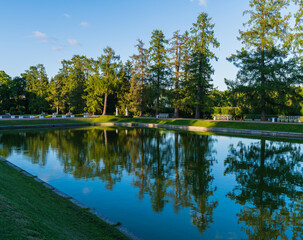 Picturesque evening landscape with reflection in the water in Catherine Park.