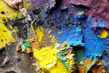 close-up detail of an old and dirty painting palette
