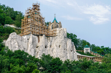 restoration of christian church on stone rock mountain in the forest