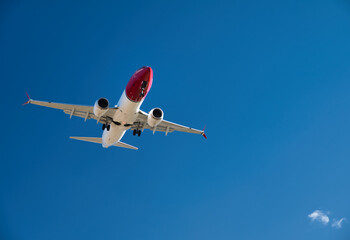Passenger airplane, flying in the blue sky