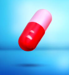 Colorful vitamin capsule in air on light blue gradient background