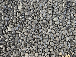 black pebbles stone for background.