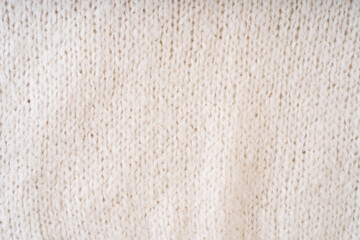Textile natural wool white background. Clothes made from natural fabric.