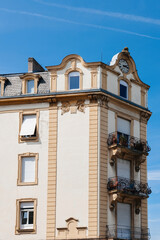 A magnificent real-estate investment reaching for the sky, adorned with an awe-inspiring clock at its pinnacle.