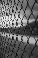 Barbed wire fence on the sunset black and white photography