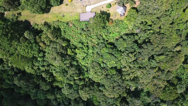 Aerial drone fly near Kew Fin viewpoint, Thailand. View of deep forest, mountains and hills in jungle. Cloudy weather.