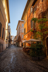 Charming Cobblestone Street with Rustic Buildings and Outdoor Café