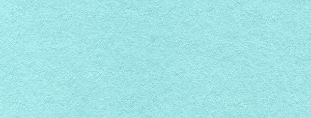 Texture of craft light blue paper background colors, macro. Structure of vintage kraft turquoise cardboard.