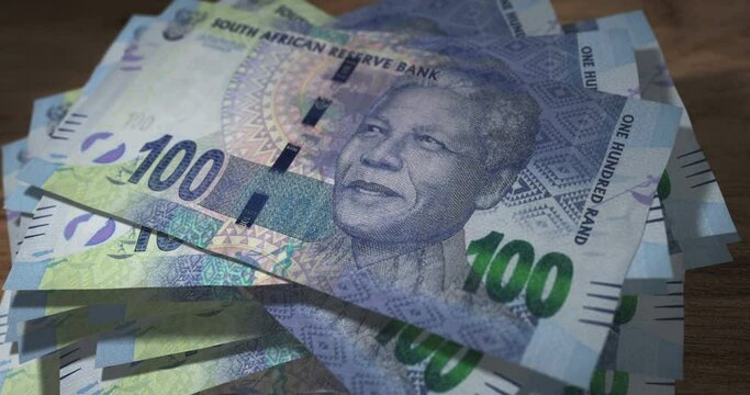 South Africa Rand banknotes falling on the table. South African 100 ZAR currency paper notes count on stack. Timelapse of money counting. 3D concept.