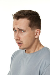 Fototapeta premium offended frustrated young man on white background. sadness