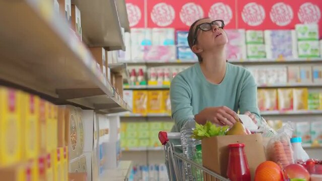 Woman checks an expensive shopping receipt and faints