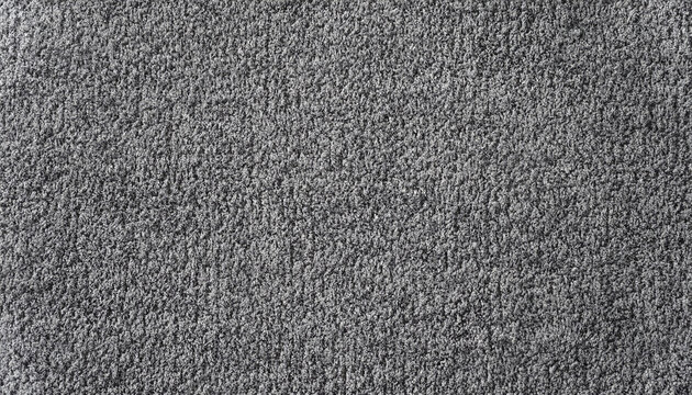 Close-up of grey monochrome carpet texture background for interior flooring material. office carpet background.